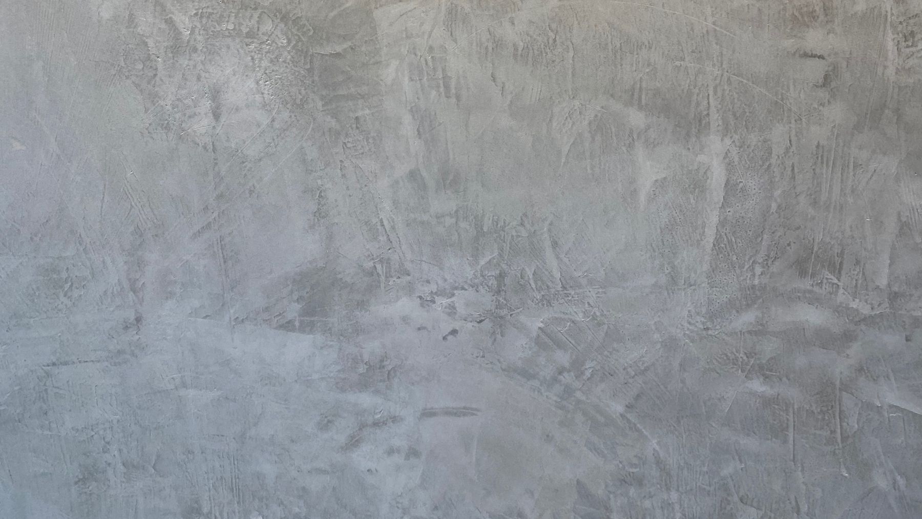 Textura de microcemento gris aplicado a mano